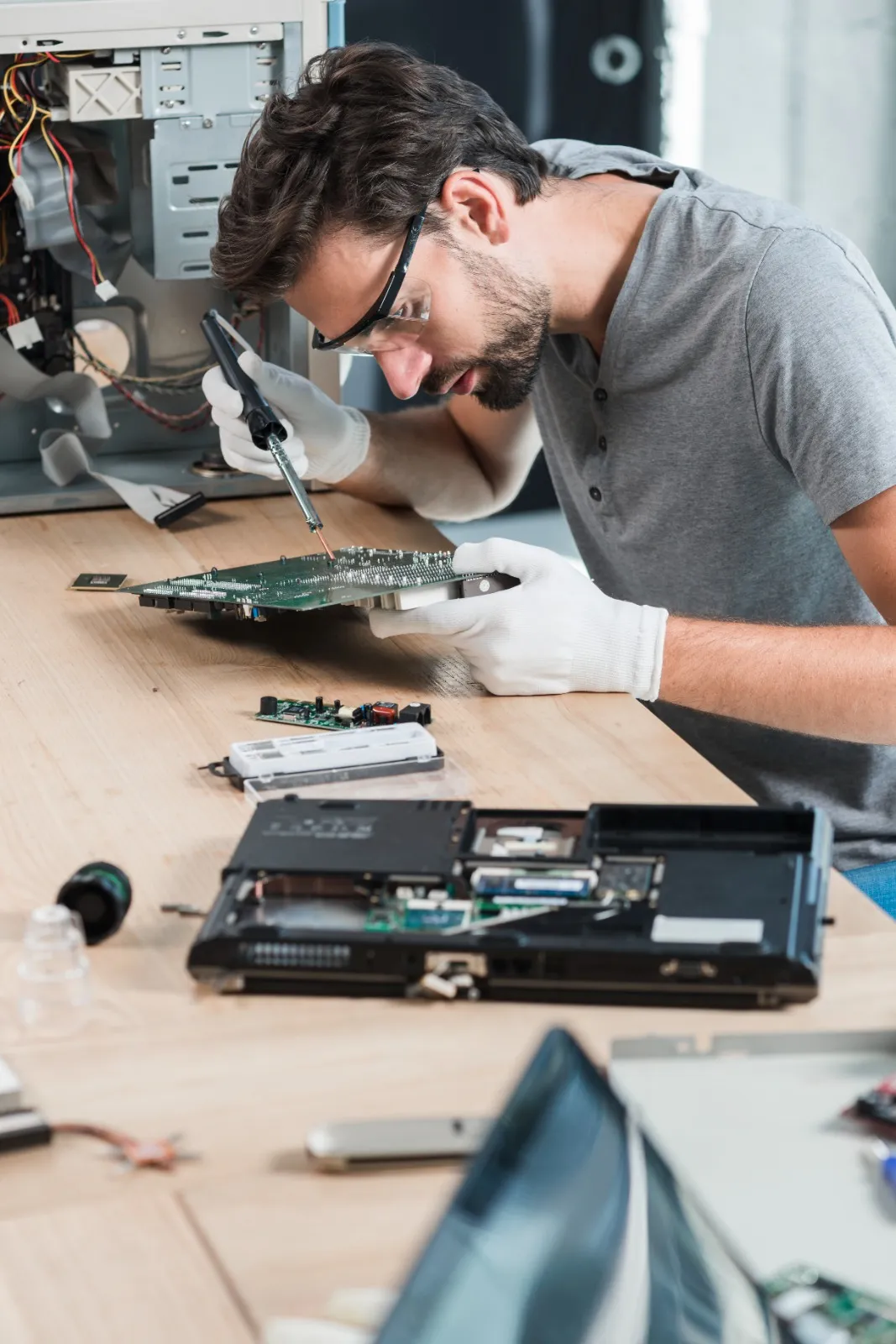 Technician repairing computer hardware